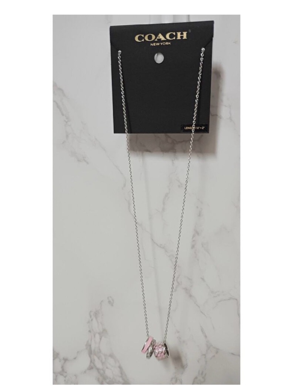 Coach Pink and Silver Ring Charm Necklace
NWT - Picture 3 of 4